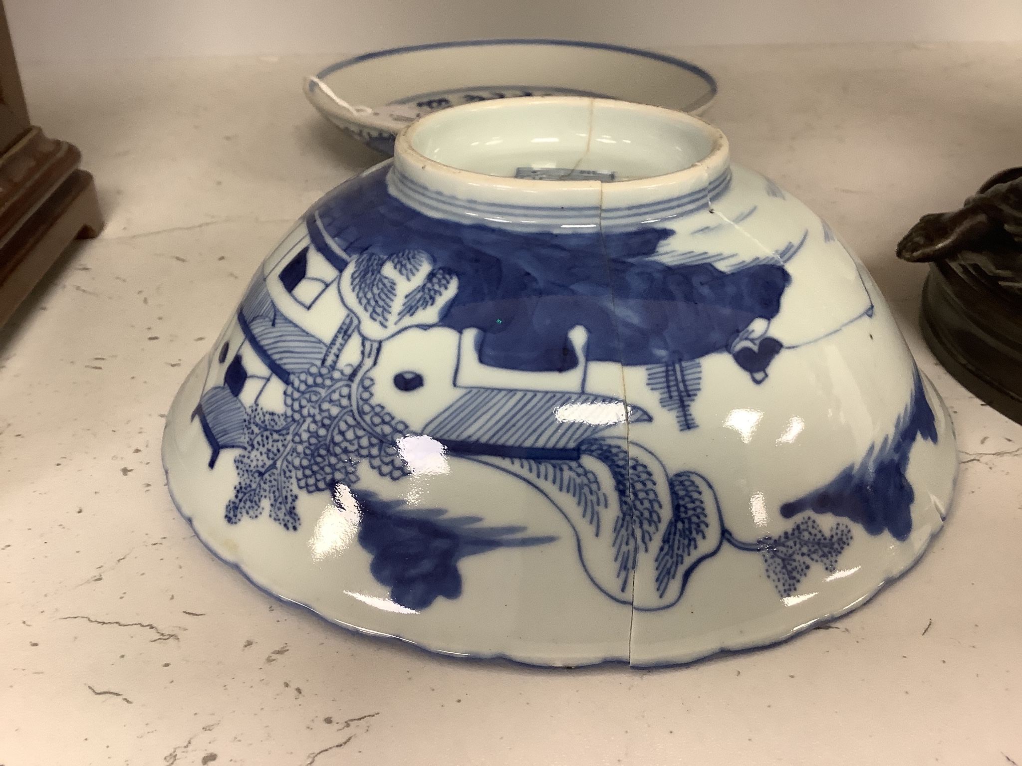 A Chinese blue and white landscape bowl, a/f and a Chinese blue and white ‘dragon’ dish, 18 and 16.5 cm